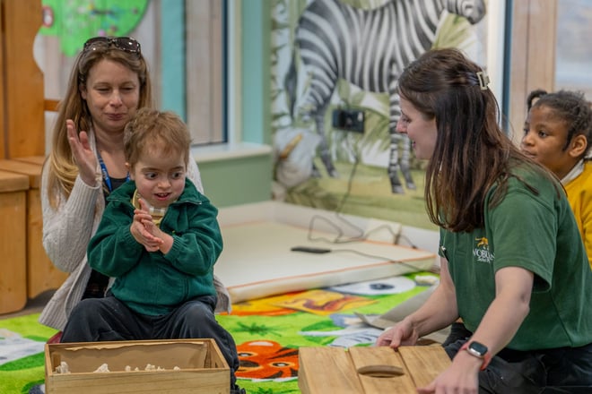 Image of child with send with tash in reading area of send classroom web 1920x1080