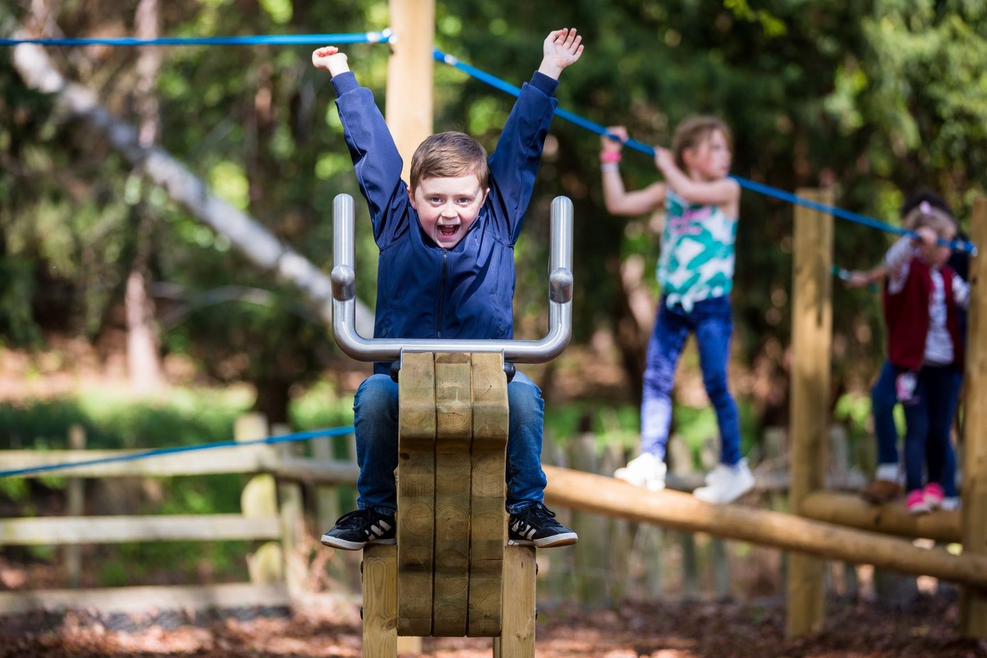 Child shouts and plays on play equiptment 
