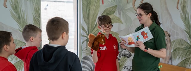 Image of children in reading area of send classroom with tash web 1920x720