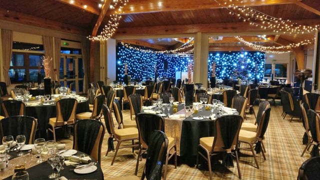 Black and gold Christmas decorations inside The Safari Lodge at Woburn Safari Park