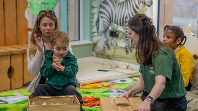 Image of child with send with tash in reading area of send classroom web 1920x1080