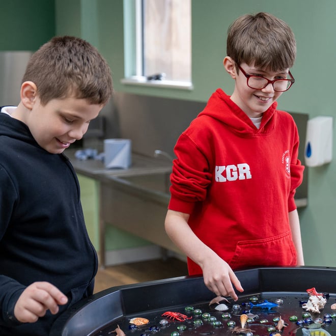 Children with SEND playing with water tough tray in new SEND Classroom at Woburn Safari Park