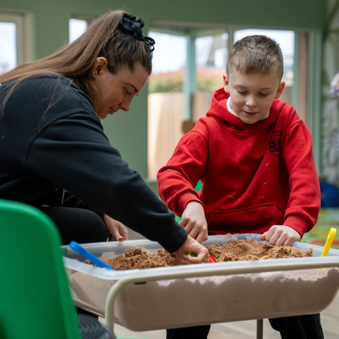 Image of school child with send & ta sand discovery play square 1080x1080
