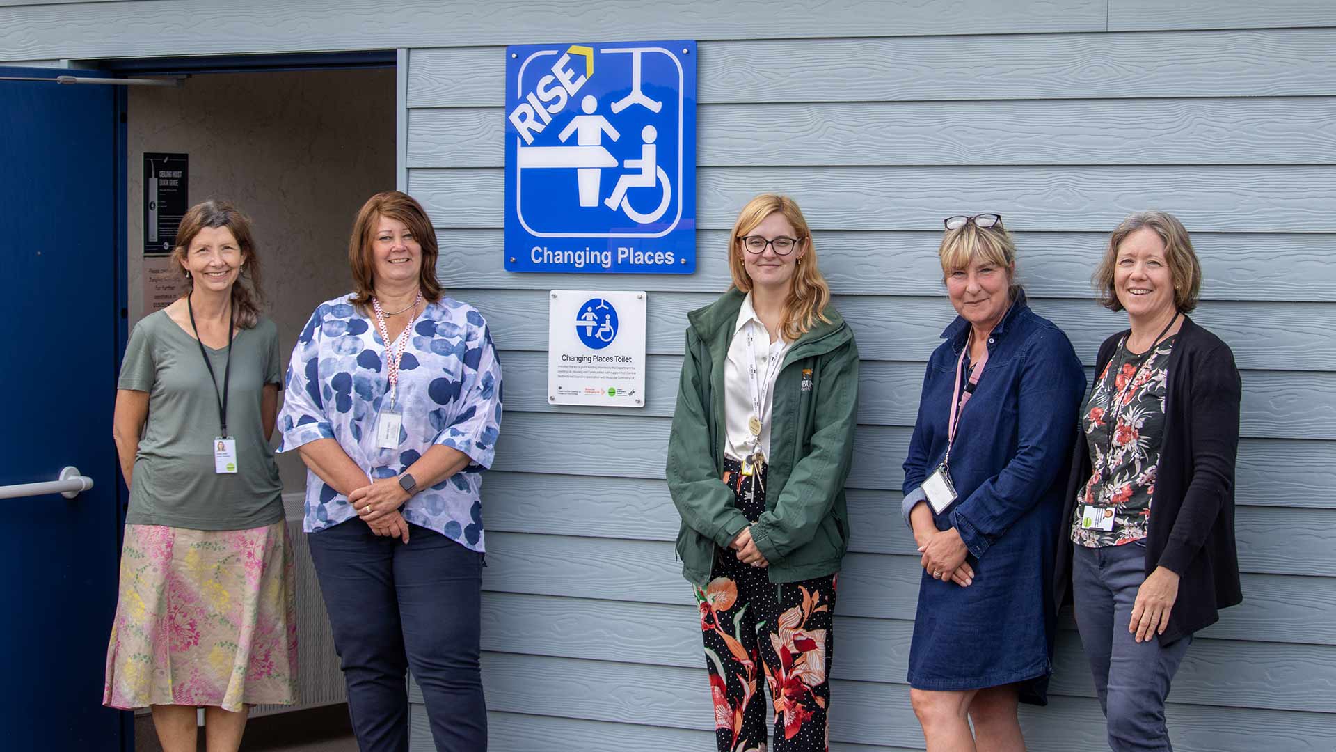 People posing outside of new Changing Places toilet block
